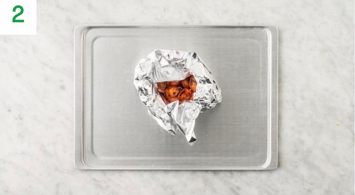 a) Pop the tomatoes onto a piece of foil. b) Drizzle over some olive oil. Season with salt, pepper and the sugar (see pantry for amount). c) Fold the foil, sealing on all sides to create a parcel, then place onto a small baking tray. d) When the oven is hot, roast the tomato parcel on the top shelf until so ened, 12-15 mins.