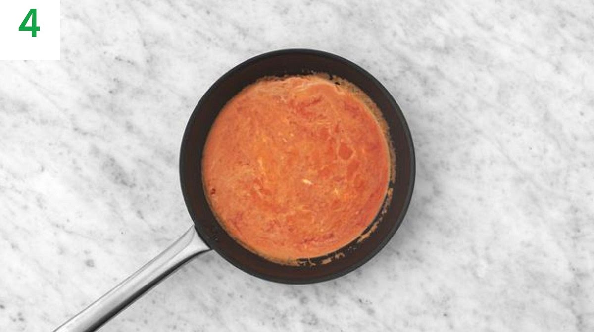 a) Meanwhile, return the (now empty) frying pan to medium-high heat with a drizzle of oil.
b) Once hot, add the vegan 'Nduja (see ingredients for amount, add less if you'd prefer things milder), tomato puree and garlic. Fry, 1 min.
c) Add the creme fraiche, veg stock paste, honey and water for the sauce (see pantry for both amounts). Season with salt and pepper.
d) Bring to a boil, then lower the heat and simmer until thickened, 2-3 mins.