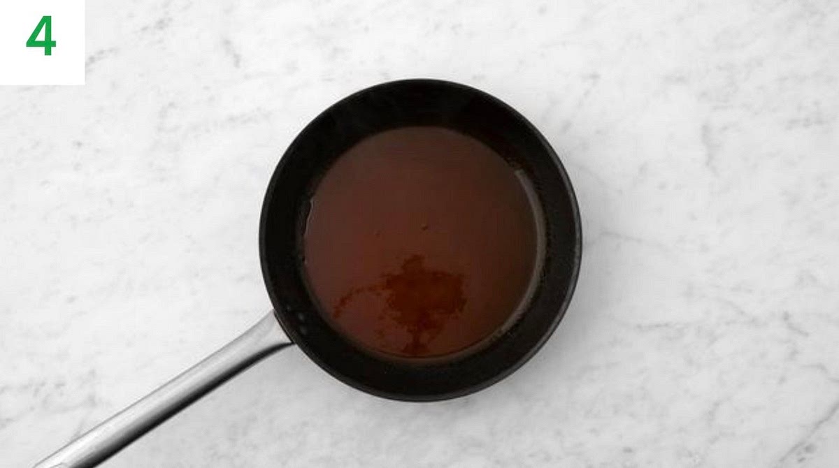 While the chicken bakes, grate the Cheddar cheese.
Trim the baby gem, halve lengthways, then thinly slice.
Cut the tomatoes into 2cm chunks.
Carefully discard the hot oil from the chicken pan, then wipe out and return to medium-high heat.
Add the hot sauce, honey and creme fraiche to the pan,
bring to the boil and cook until thickened, 1-2 mins. TIP: If your honey has hardened, put the sachet in a bowl of
hot water for 1 min to loosen.
Add a splash of water if it's a little too thick, then remove from the heat.