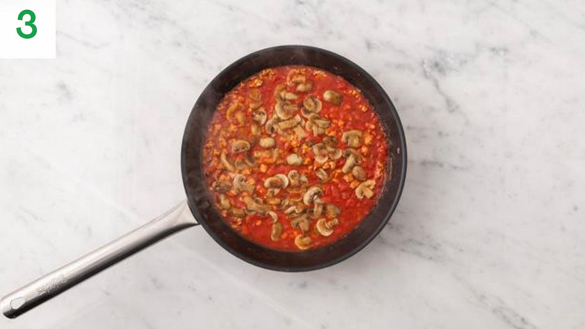 When the sausage meat is browned, add the chopped tomatoes to the pan.
Simmer until the sausage meat is cooked through, 5-6 mins. IMPORTANT: The sausage meat is cooked when no longer pink in the middle.