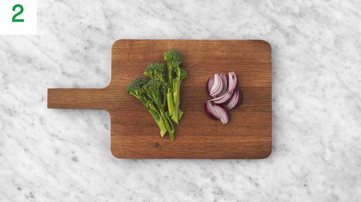 Halve any thick broccoli stems lengthways.
Halve and peel the red onion, then cut each half into 4 wedges.