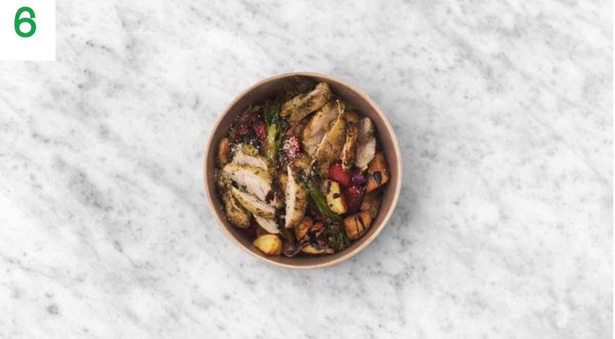 When everything's ready, drizzle the honey and sun-dried tomato paste over the roasted veg. Toss to coat evenly.
Share the potato chunks and roasted veg between your serving bowls.
Top with the pesto chicken and sprinkle over the hard Italian style cheese. Finish by drizzling over the balsamic glaze.