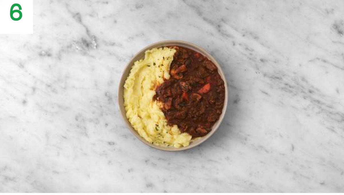 Share your lamb stew between your bowls with the mash alongside.
Sprinkle over the remaining thyme to finish.