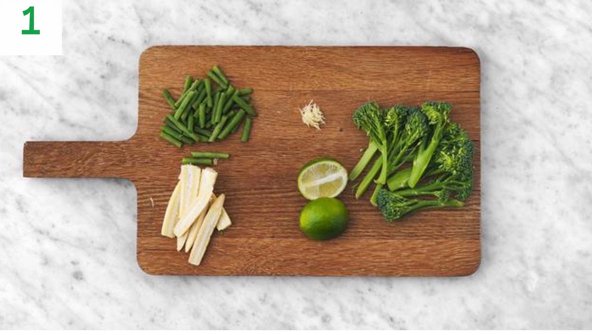 Bring a large saucepan of water to the boil with ½ tsp salt for the noodles.
Halve any thick broccoli stems lengthways, then cut widthways into thirds. Halve the baby corn lengthways.
Trim the green beans, then cut into thirds. Peel and grate the garlic (or use a garlic press).
Halve the lime (see ingredients for amount).