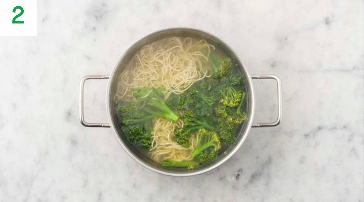 When boiling, add the noodles, green beans and broccoli to the water.
Cook until tender, 4 mins.
Once cooked, drain in a sieve and run under cold water to stop the noodles sticking together and to keep the veg vibrant.