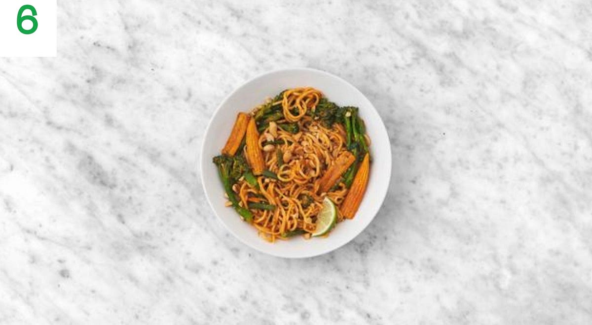 Share the veggie noodle stir-fry between your bowls.
Crush the peanuts in the unopened sachet using a rolling pin, then sprinkle over the top to finish.
Serve with any remaining lime cut into wedges for squeezing over.