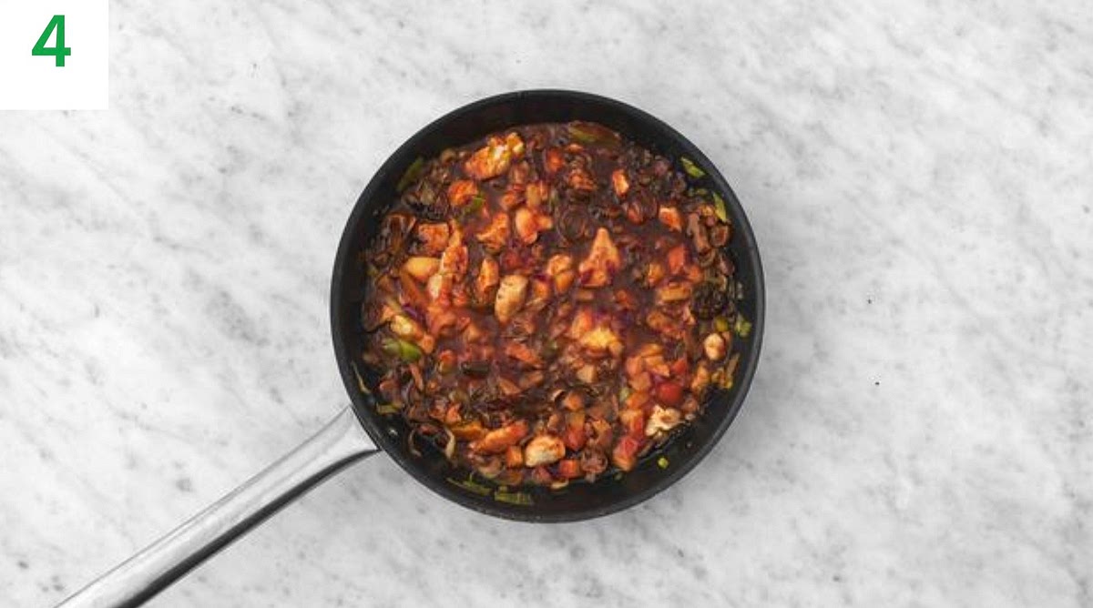 Stir the prunes, mixed herbs and red wine stock paste into the sauce.
Simmer, stirring regularly, until the sauce has thickened and the chicken is cooked through, 7-8 mins.