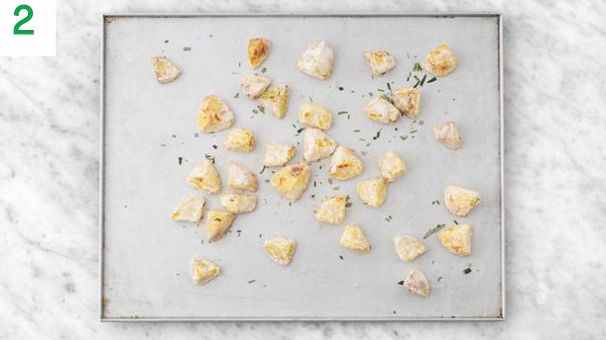 When the potatoes are ready, drain in a colander and sprinkle on the flour (see pantry for amount) and dried rosemary.
Shake to fluﬀ up the potatoes, then carefully add them to the hot baking tray, turning in the oil.
Season with salt, then roast on the top shelf until
golden, 30-35 mins. Turn halfway through.
