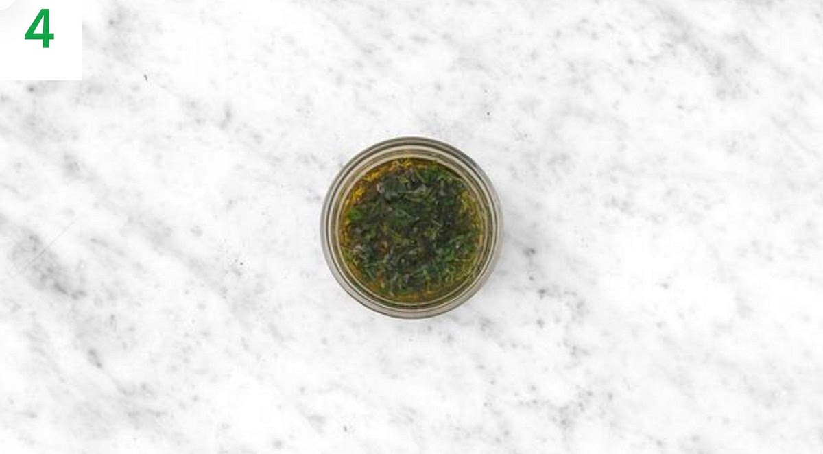 Meanwhile, pick the mint leaves from their stalks and roughly chop (discard the stalks). Roughly chop the capers. Halve the lemon.
In a small bowl, combine the capers, mint, olive oil for the salsa and half the lemon juice. Season with salt and pepper, mix well and set aside your salsa verde.
About 15 mins before the potatoes and carrots are ready, halve any thick broccoli stems lengthways.
Add the Tenderstem® broccoli to the tray with the carrots, drizzle with oil and season with salt and pepper. Return to the oven for the remaining time, 10-12 mins.