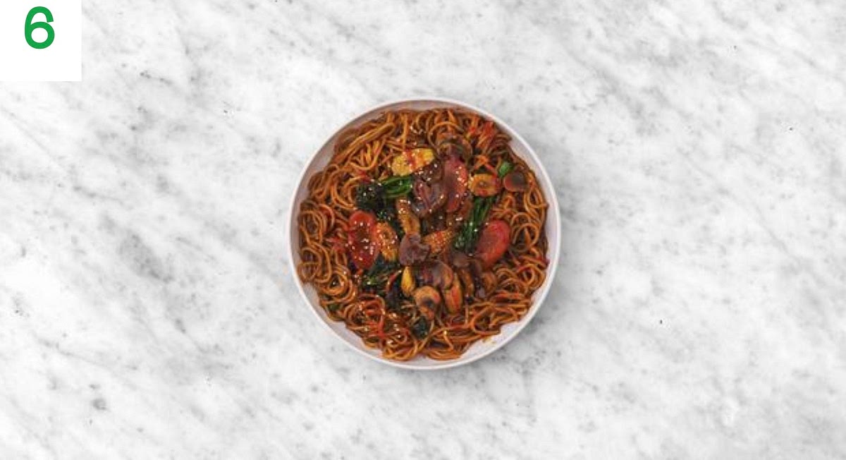 Share the noodles between your bowls.
Sprinkle on the sesame seeds and drizzle over the sriracha sauce.
Serve the lime wedges on the side for squeezing over.