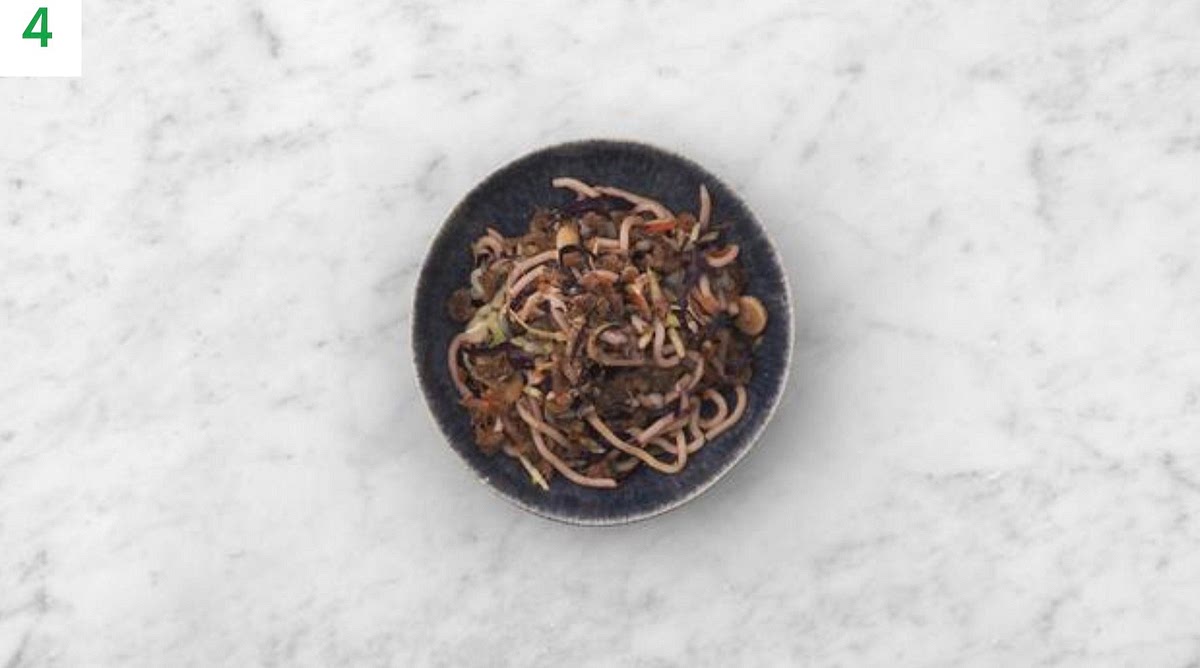 Share the noodles between your serving bowls.
Sprinkle over the peanuts to finish.