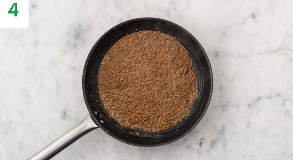 Heat a drizzle of oil in a medium frying pan on medium heat.
Once hot, add the garlic and stir-fry for 30 secs.
Add the lentils to the pan and stir together until piping hot, 1-2 mins. Season to taste with salt and pepper, then remove from the heat.