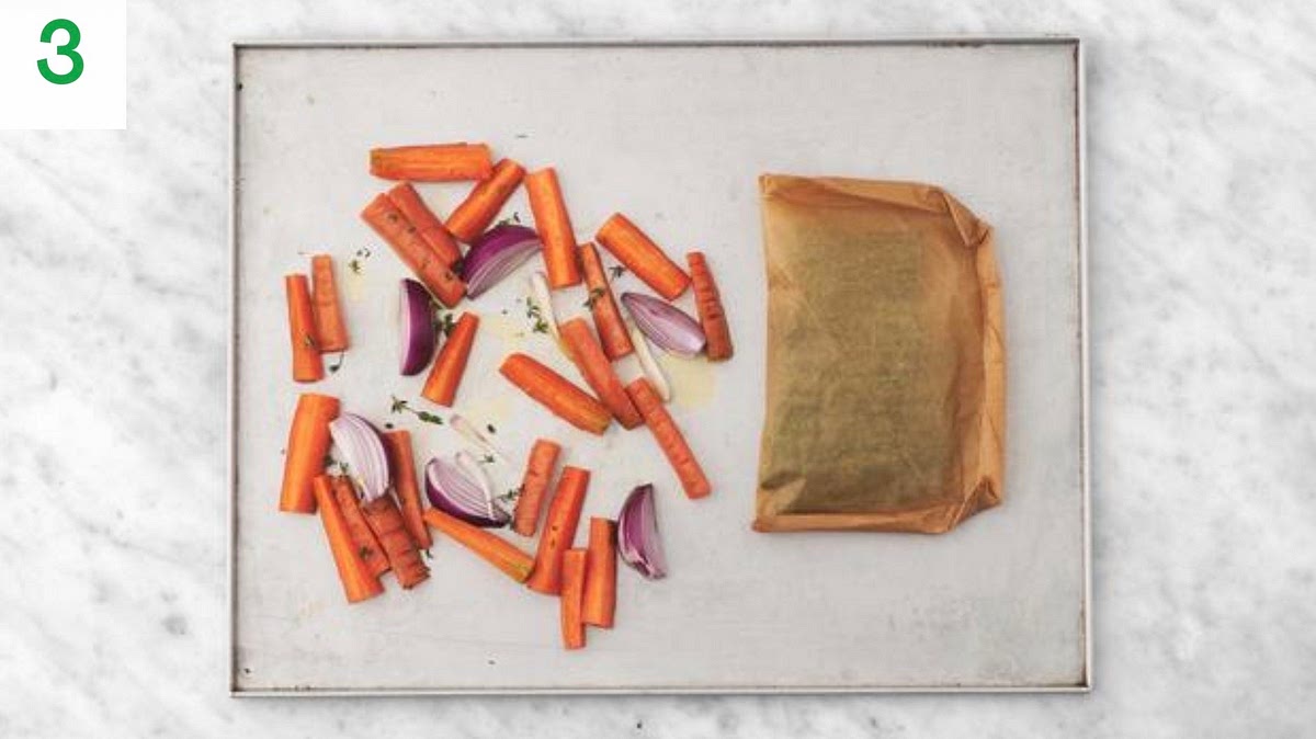 Pop the carrots onto one side of a baking tray. Drizzle with oil, sprinkle over half the thyme and season with salt and pepper. Toss to coat.
Roast on the top shelf of hour oven until softened, 25-30 mins. Turn halfway through.
When the carrots have roasted for 5 mins, add the green bean foil parcel to the middle shelf of the oven and roast until tender, 20-25 mins.
Meanwhile, season each chicken breast with salt and pepper.