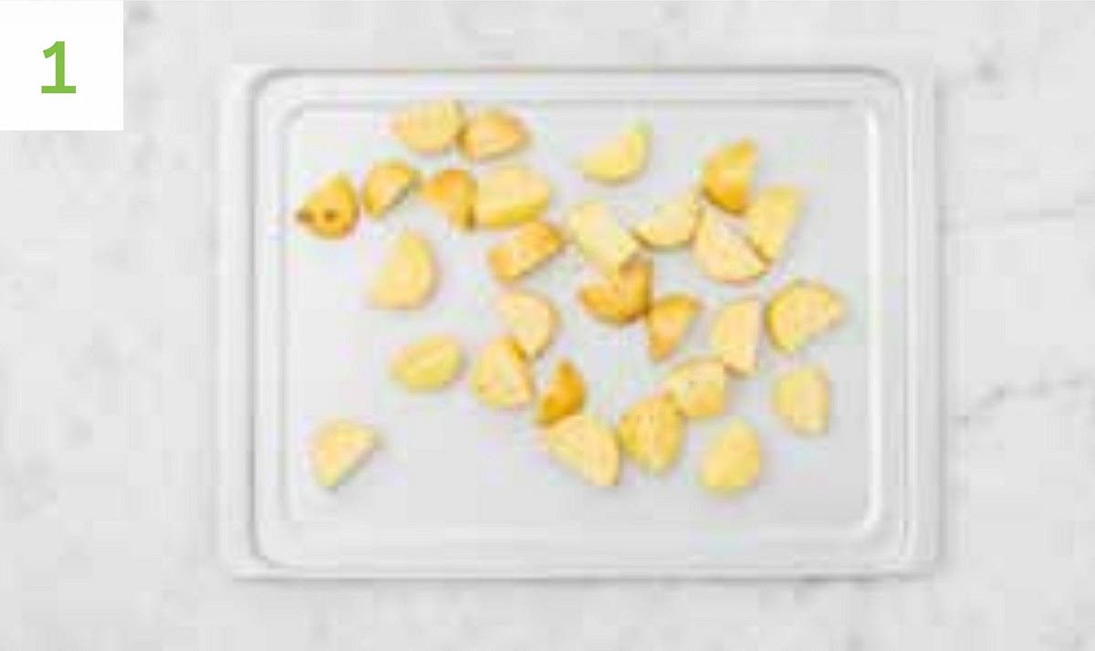 Preheat your oven to 220°C/ 200°C fan/ gas mark 7.
Remove the steaks from your fridge to allow them to come up to room temperature.
Chop the potatoes into 2cm chunks (no need to peel). Pop onto a large baking tray. Drizzle with oil, season with salt and pepper, then toss to coat.
Spread out in a single layer.
When the oven is hot, roast on the top shelf until golden, 25-35 mins. Turn halfway through.