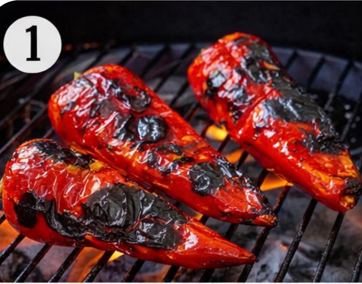 Roast the peppers and tomatoes on a grill, stovetop, or in the oven until the skins are well charred.