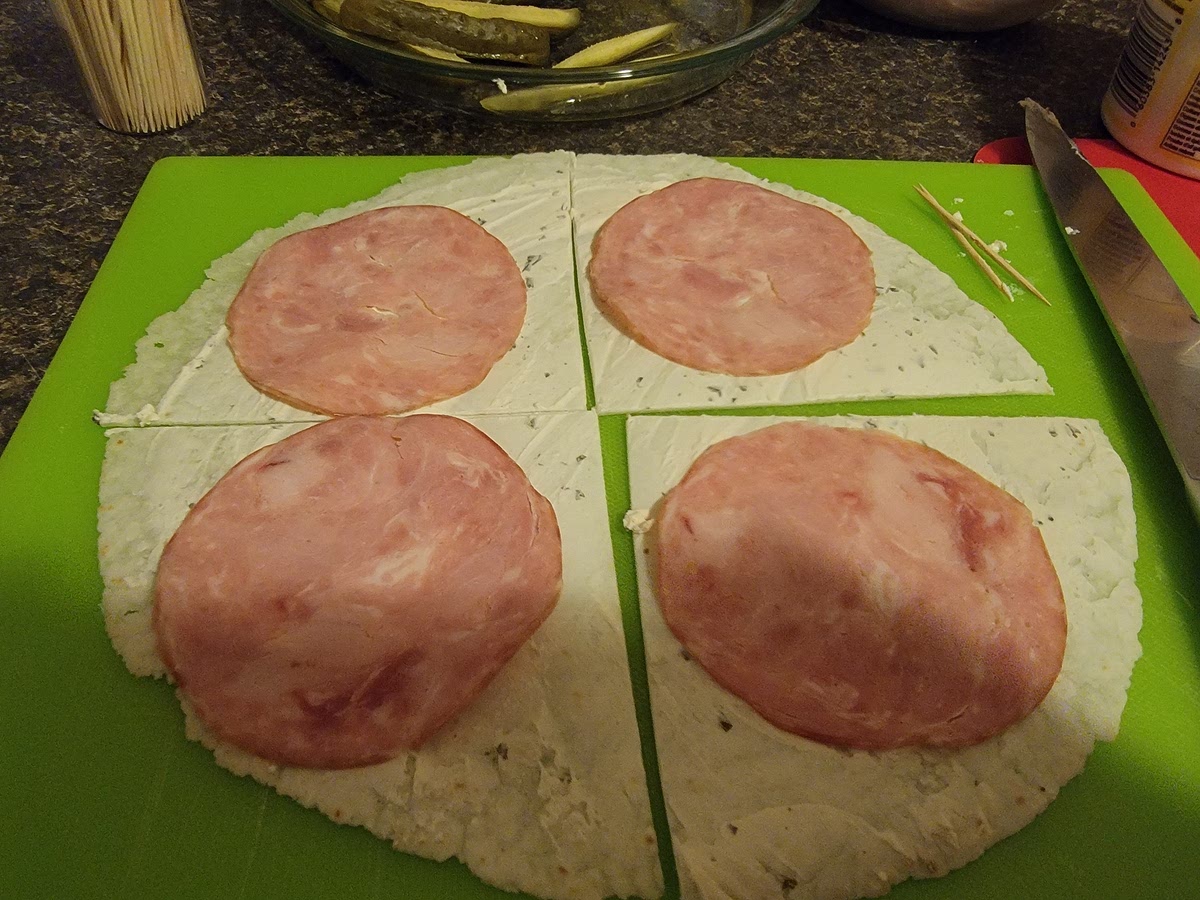 If using meat, place a piece on each of the 4 pieces of tortilla. skip this step for the vegetarian version.