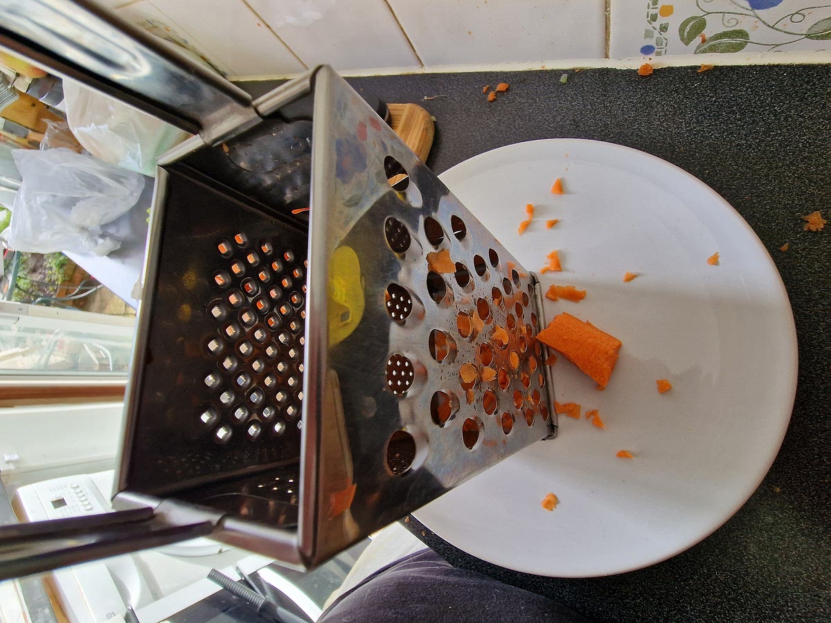 Carrots in this quantity are a pain to dice into small pieces so I usually use cheese grater as it gets the job done much faster and the carrots are diced to whatever size you want. I like it quite fine so after peeling the carrot I slice it into quarters and then I grate it.