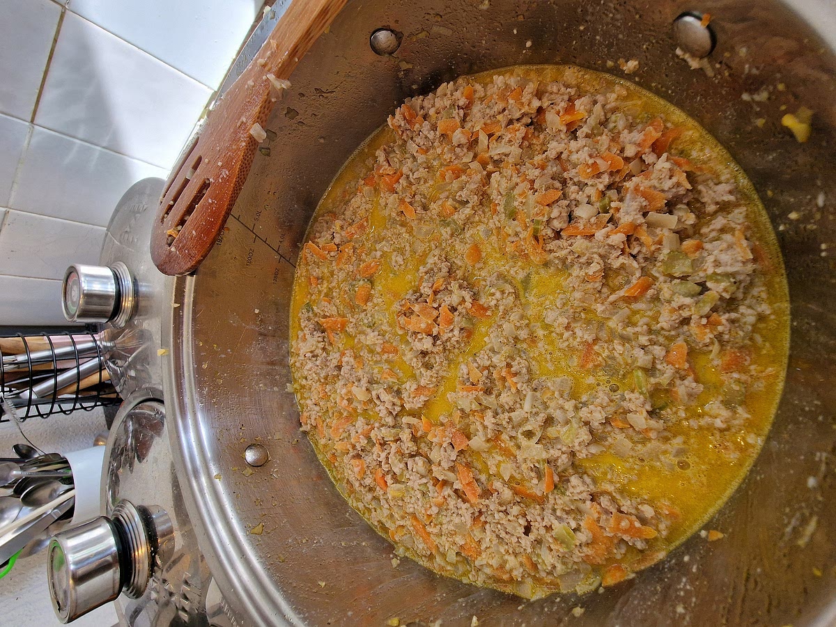 Once the meat is brown, add the milk to help it soften nicely. I add about 500ml of milk (1 pint) but it depends on the amount of meat you're using. Rule is to have the meat just barely covered in milk. Let it cook and stirr it regularly until the milk completely evaporates.
