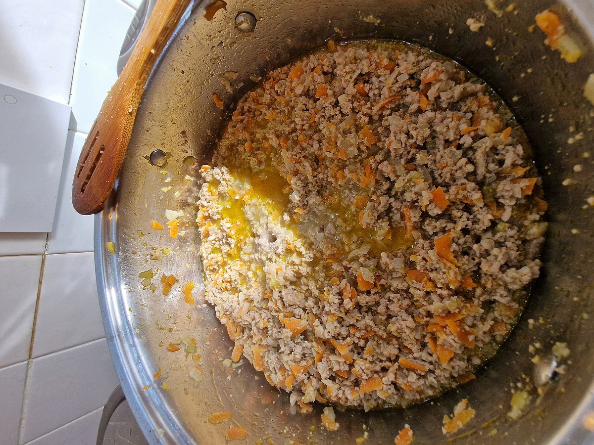 Once the milk is evaporated, you can grate half a nutmeg into it. Give it a stirr and then you can add the wine. I used one full glass, this really depends on you and how strong your wine is. I used a French dry white wine. It's okay to use red wine if that's what you have, it will give the sauce more depth but use less of it as it can overpower the flavour of meat if you overdo it. Let the wine evaporate completely just like with the milk.