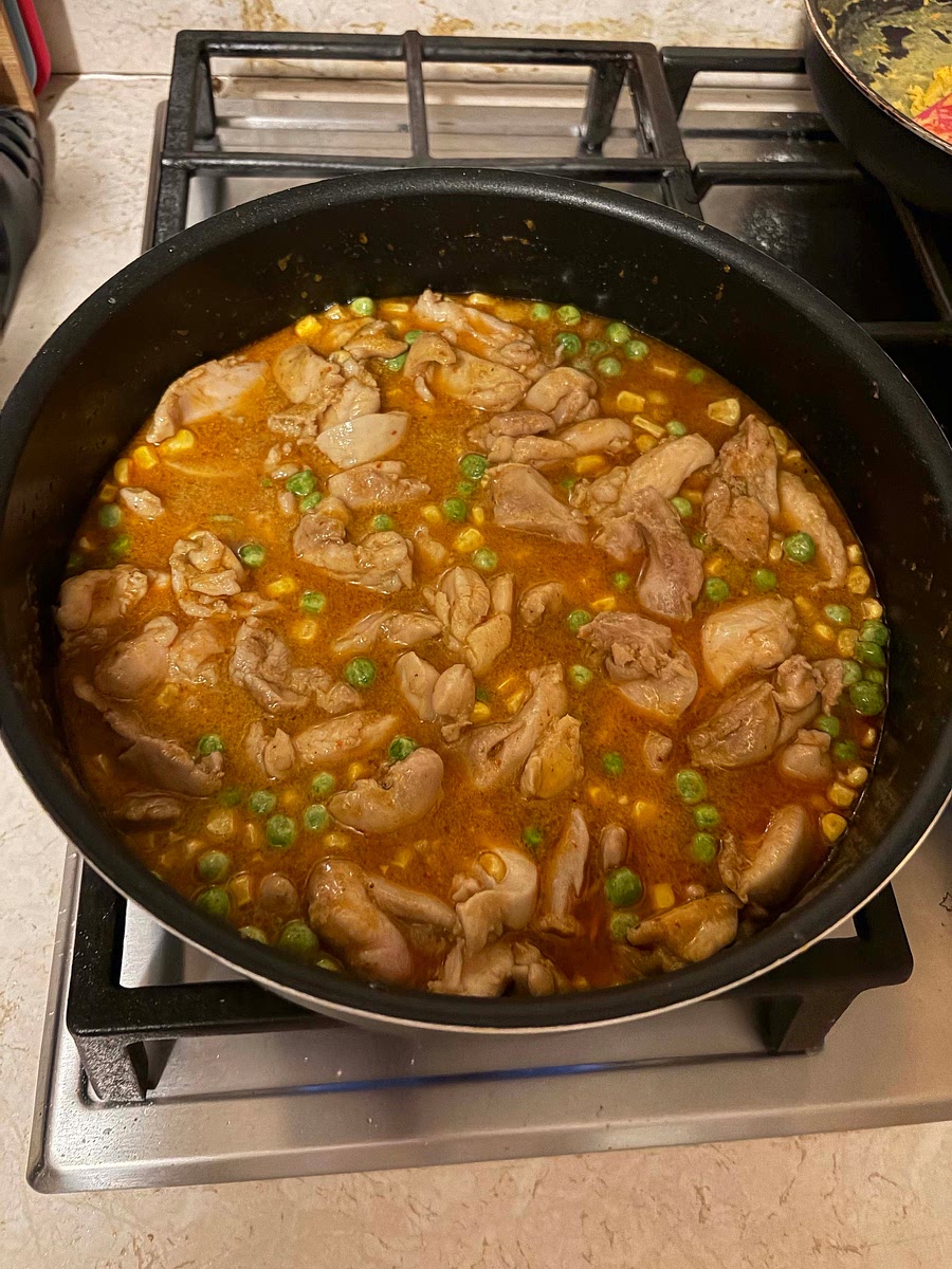 Turn heat up and add the vegetables and remaining coconut water from the can.