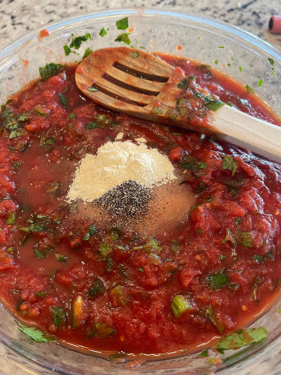 Add in your seasonings. I like to give it a a quick mix first.