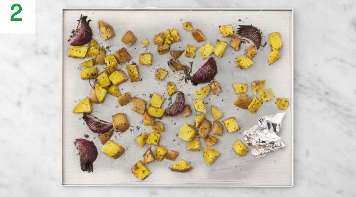 When the oven is hot, roast the veg on the middle shelf until golden, 30-40 mins. Turn halfway through. Meanwhile, pop the garlic (unpeeled) into a small piece of foil with a drizzle of oil and scrunch to enclose it.
Roast the parcel until soft, 10-12 mins.