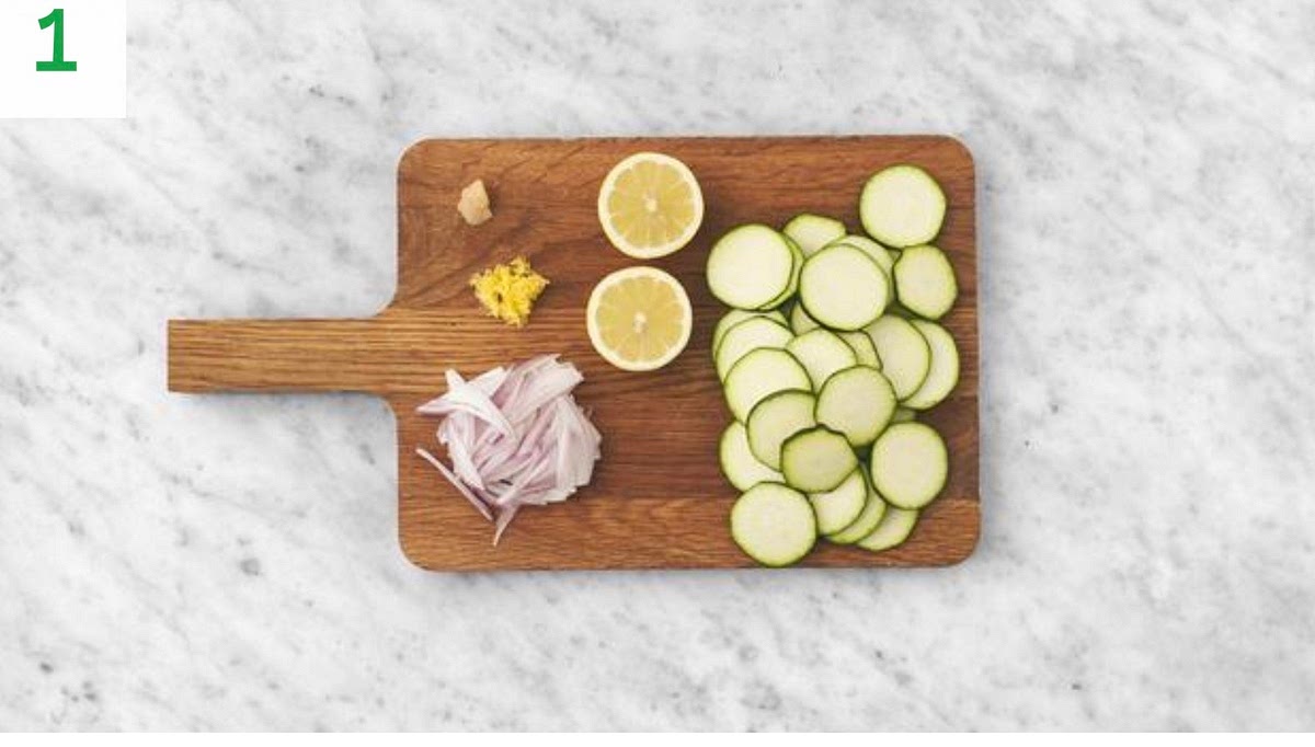 Put a large saucepan of water with 1/2 tsp salt on the boil for the paste.
Halve, peel and thinly slice the shallot. Peel and grate the garlic.
Trim the courgette and slice into 1cm thick rounds.
Zest and halve the lemon.