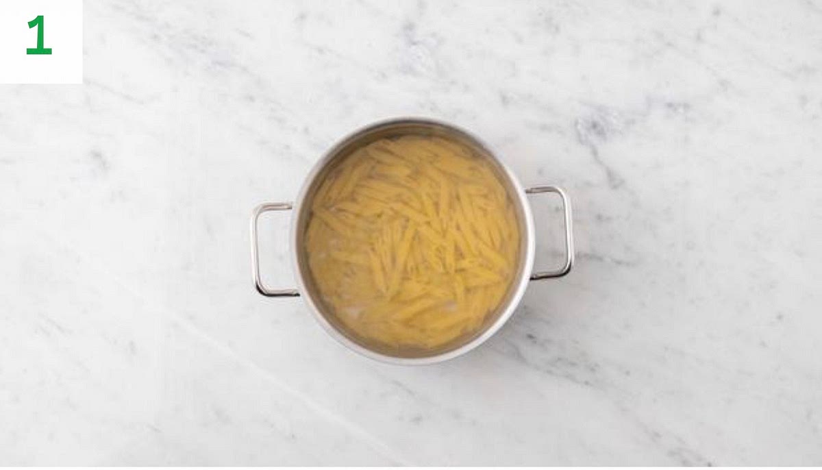 Bring a large saucepan of water to the boil 1/2 tsp salt.
When boiling, add the penne to the water and bring back to the boil. Cook until tender, 12 mins.
Once coked, drain in a colander and pop back into the pan. Drizzle with oil and stir through to stop it sticking together.