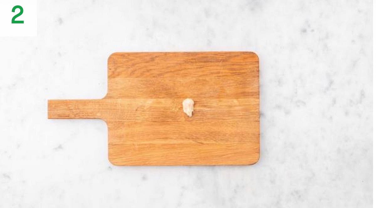 Meanwhile, peel and grate the garlic (or use a garlic press).