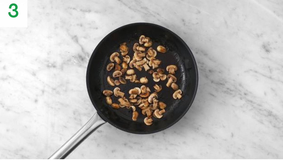 Meanwhile, heat a drizzle of oil in a large frying pan on high heat.
When hot, add mushrooms to the pan.
Season with salt and pepper and fru, stirring occasionally, until browned, 5-6 mins.