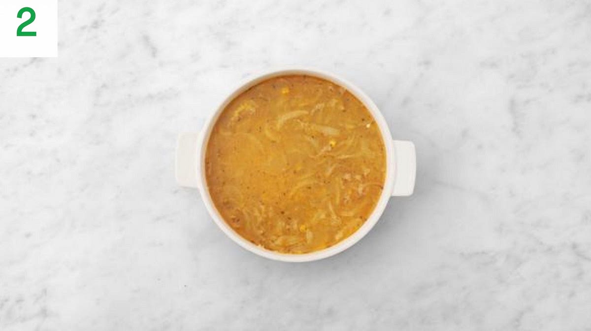 Heat a drizzle of oil in a large, wide-bottomed ovenproof pan on medium heat.
Once hot, add the onion and corn and cook until softened slightly, 4-5 mins.
Next, add the garlic, Central American style spice mix and risotto rice. Stir and cook until the edges of the rice are translucent, 1-2 mins.
Stir in the boiled water for the risotto and white wine stock powder. Bring back up to the boil, then pop a lid on the pan.