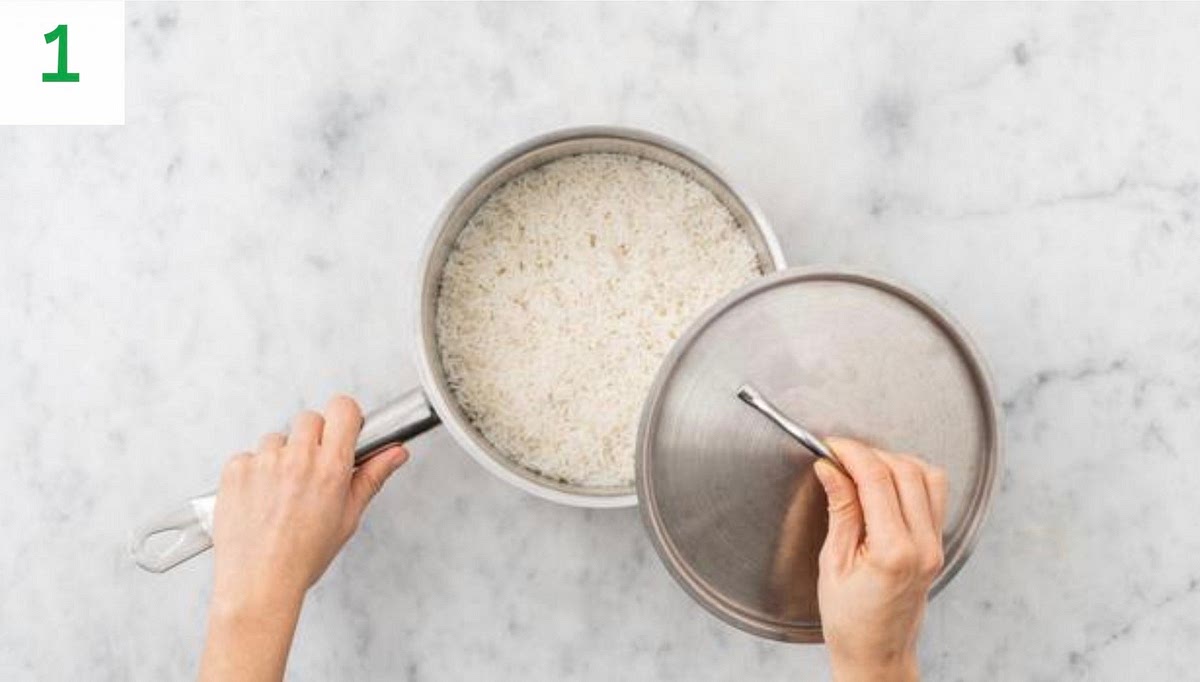 Pop a deep saucepan on medium heat. Melt in the butter.
Peel and grate the garlic.
When the butter has melted, add half the garlic and stir-fry for 1 min. Stir in the rice until coated, 1 min.
Add 1/4 tsp salt and the water for the rice and bring to a boil. Once boiling, turn the heat down to medium and cover the lid.
Leave to cook for 10 mins, then remove from pan from the heat and leave to the side for another 10 mins or until ready to serve.