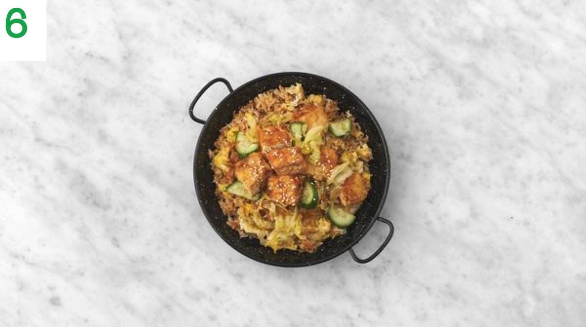 Divide the rice between your bowls.
Top with the Anhui bang tofu.
Sprinkle over the sesame seeds and enjoy.