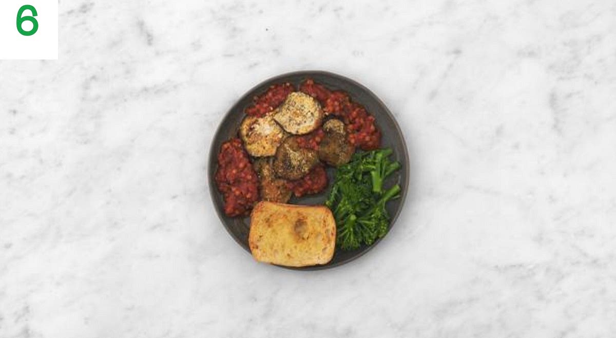 When ready, share the veggie moussaka between your bowls.
Serve with the broccoli and garlic ciabatta alongside.