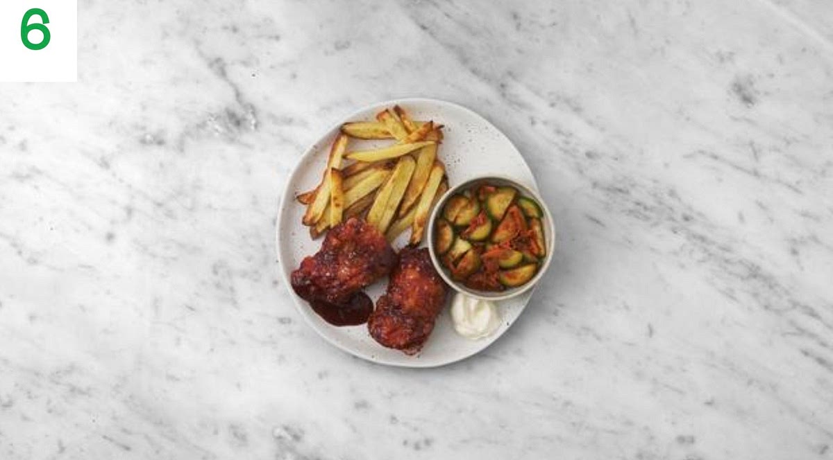 Share the chicken between your plates and spoon over any remaining sauce.
Serve with the pickled salad and chips on the side. Add some mayonnaise (see pantry for amount) for dipping.