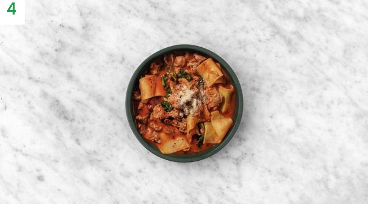 Share your lasagne soup between bowls.
Sprinkle over the remaining cheese and chilli.