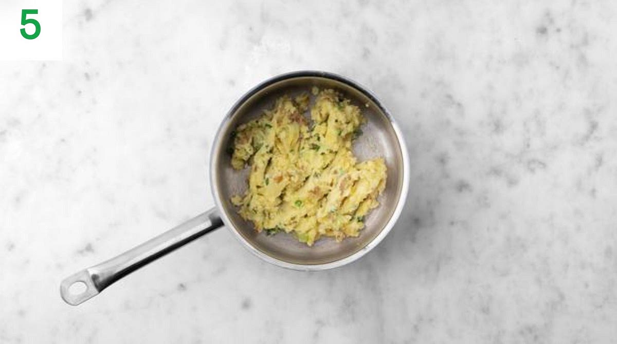 Once the chicken and mushrooms are cooked, add the garlic to the pan. Stir-fry for 1 min.
Pour in the chicken stock paste and water for the sauce (see pantry for amount), then bring to the boil and reduce by half, 2-3 mins.
Stir through the creme fraiche and mustard until everything's piping hot, 2-3 mins.