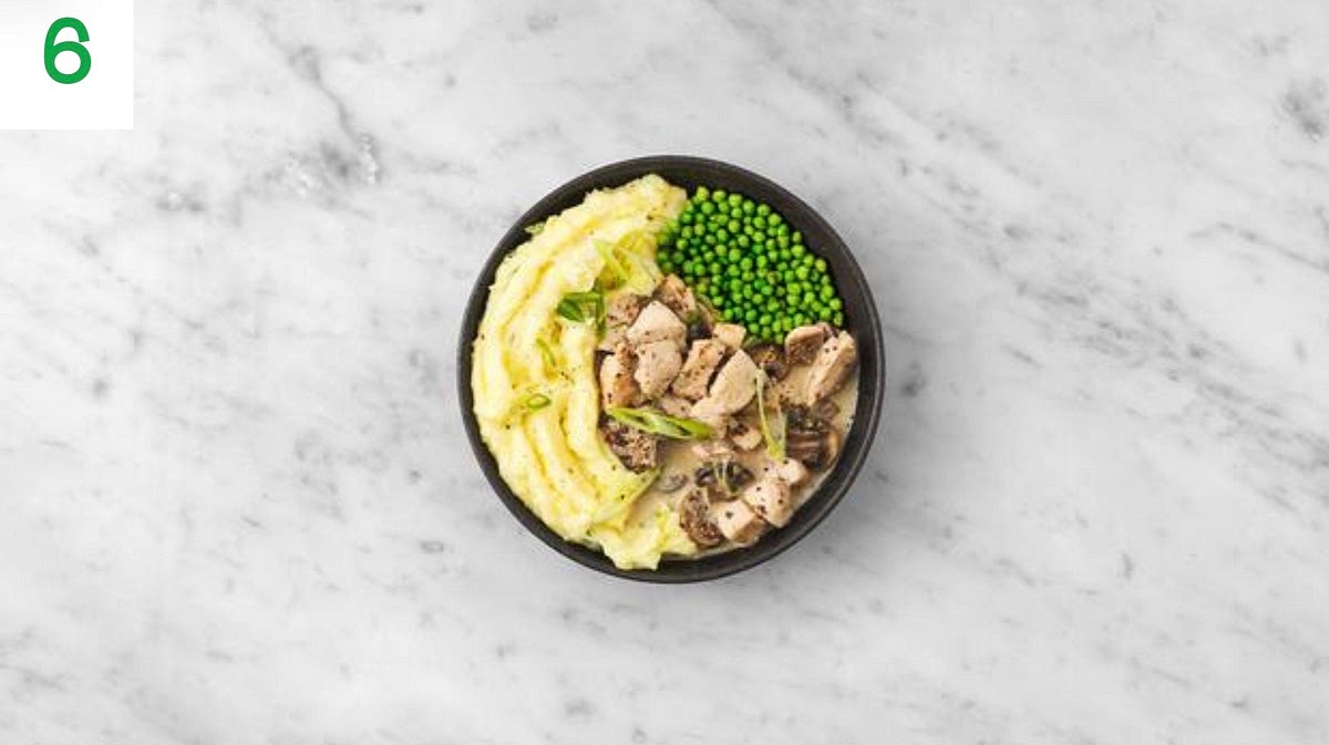 Once the chicken and mushrooms are cooked, add the garlic to the pan. Stir-fry for 1 min.
Pour in the chicken stock paste and water for the sauce (see pantry for amount), then bring to the boil and reduce by half, 2-3 mins.
Stir through the creme fraiche and mustard until everything's piping hot, 2-3 mins.