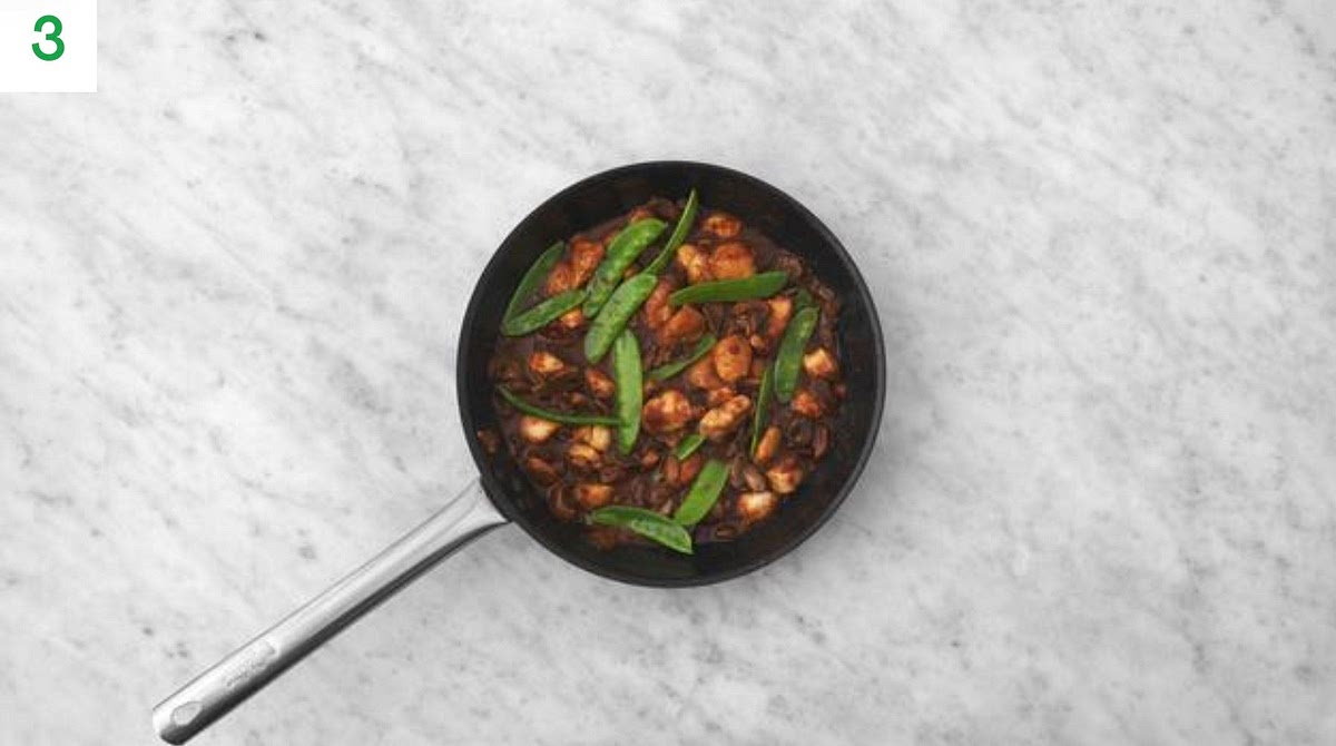 Once the chicken is cooked, add the ketjap, miso, honey, and water for the sauce (see pantry).
Bring to a boil and simmer until thickened slightly, 2-3 mins.
Add a squeeze of lime juice and remove from the heat.