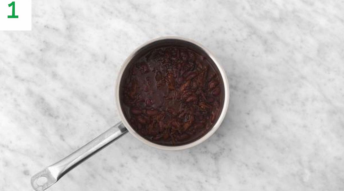 Drain and rinse the kidney beans in a sieve.
Remove the beef from the packet and cut into 2cm chunks (reserve the juices in the packet to add later).
Heat a drizzle of oil in a large saucepan on medium heat. Once hot, add the chipotle paste and fry for 30 secs.
Next, add the passata, red wine stock paste, honey and water for the sauce (see pantry for both amounts). Bring to the boil, then lower the heat to a simmer.