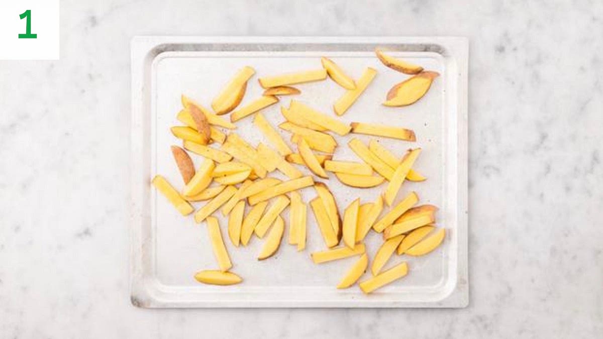 Preheat your oven to 220°C/200°C fan/gas mark 7.
Cut the potatoes lengthways into 1cm slices, then cut into 1cm wide fries (no need to peel).
Pop the fries onto a large baking tray. Drizzle with oil, sprinkle over half the Central American style spice mix, season with salt and pepper, then toss to coat. Spread out in a single layer. When the oven is hot, bake on the top shelf until golden, 25-30 mins.