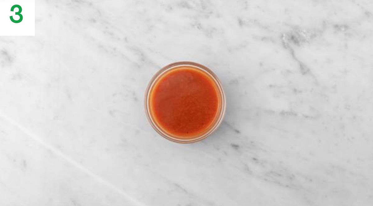 Put the hot sauce and honey in a small bowl and mix together. TIP: If your honey has hardened, pop it in a bowl of hot water for 1 min.