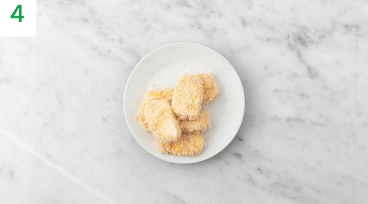 Remove the halloumi slices from the cold water and pat dry with kitchen paper. Sprinkle over the remaining
Central American style spice mix.
Wipe out the (now empty) halloumi bowl, then crack the egg (see pantry for amount) into it and whisk.
Put the breadcrumbs into another bowl and season with salt and pepper.
Dip the halloumi into the egg, then the breadcrumbs, ensuring it's completely coated. Shake off the excess and transfer to a plate.