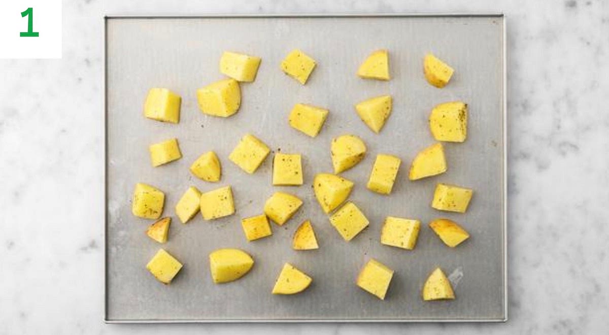 Preheat your oven to 220°C/200°C fan/gas mark 7.
Chop the potatoes into 2cm chunks (no need to peel).
Pop the chunks onto a large baking tray. Drizzle with oil, season with salt and pepper, then toss to coat.
Spread out in a single layer. TIP: Use two baking trays if necessary.
When the oven is hot, roast on the middle shelf until golden, 30-40 mins. Turn halfway through.