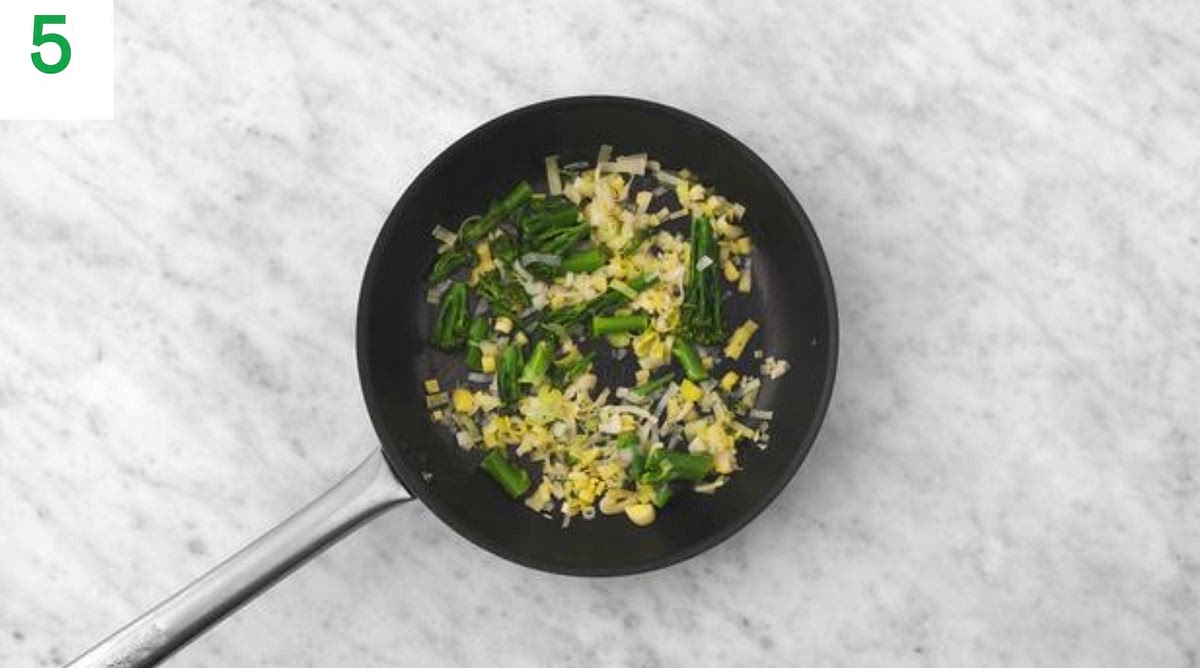 While the chicken bakes, give the frying pan a quick clean, then return to medium-high heat with a drizzle of oil.
Once hot, add the Tenderstem® and leek and stir-fry for
2-3 mins. Add the garlic and fry for 1 min more.
Add a splash of water, then cover with a lid (or foil) and allow to cook until tender, 4-6 mins more. Season with salt and pepper. Stir in the butter (see pantry for amount) until melted.
Meanwhile, add the sriracha and mayo (see pantry for amount) to a small bowl and mix together.