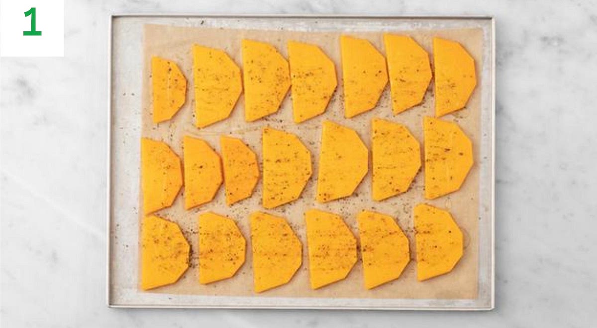 Preheat your oven to 220°C/200°C fan/gas mark 7.
Trim the butternut squash, halve lengthways, then scoop out the seeds (peel first if you prefer). Cut widthways into 1cm slices.
Pop the butternut slices onto a large lined baking tray.
Drizzle with oil, sprinkle over the Central American style spice mix, season with salt and pepper, then toss to coat. Spread out in a single layer. TIP: Use two baking trays if necessary.
When the oven is hot, roast the butternut on the top shelf until golden and cooked through, 25-30 mins. Turn halfway through.