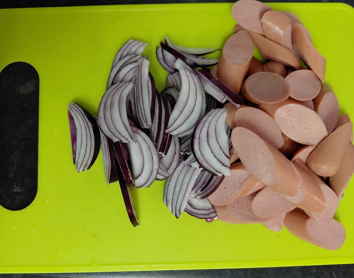 Cut your sausages and onion into your desired shape.