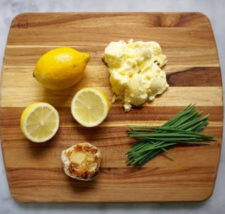 Prep the Garnishes: Finely mince fresh chives and slice a lemon into wedges.
