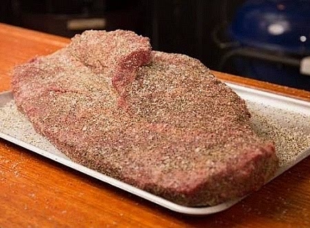 Season: Apply an even coating of coarse kosher salt and 16-mesh black pepper and add mustard.
