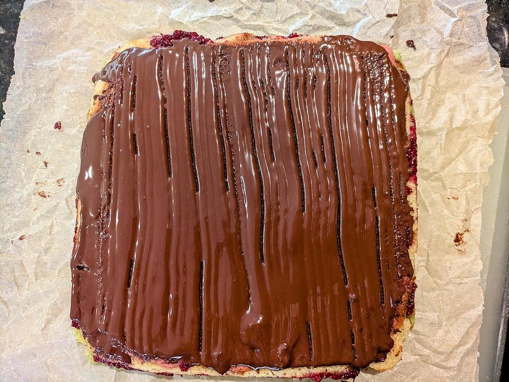 Flip the cake and repeat with the other half of the chocolate on the other side. Again, chill to harden the chocolate, at least 30 minutes